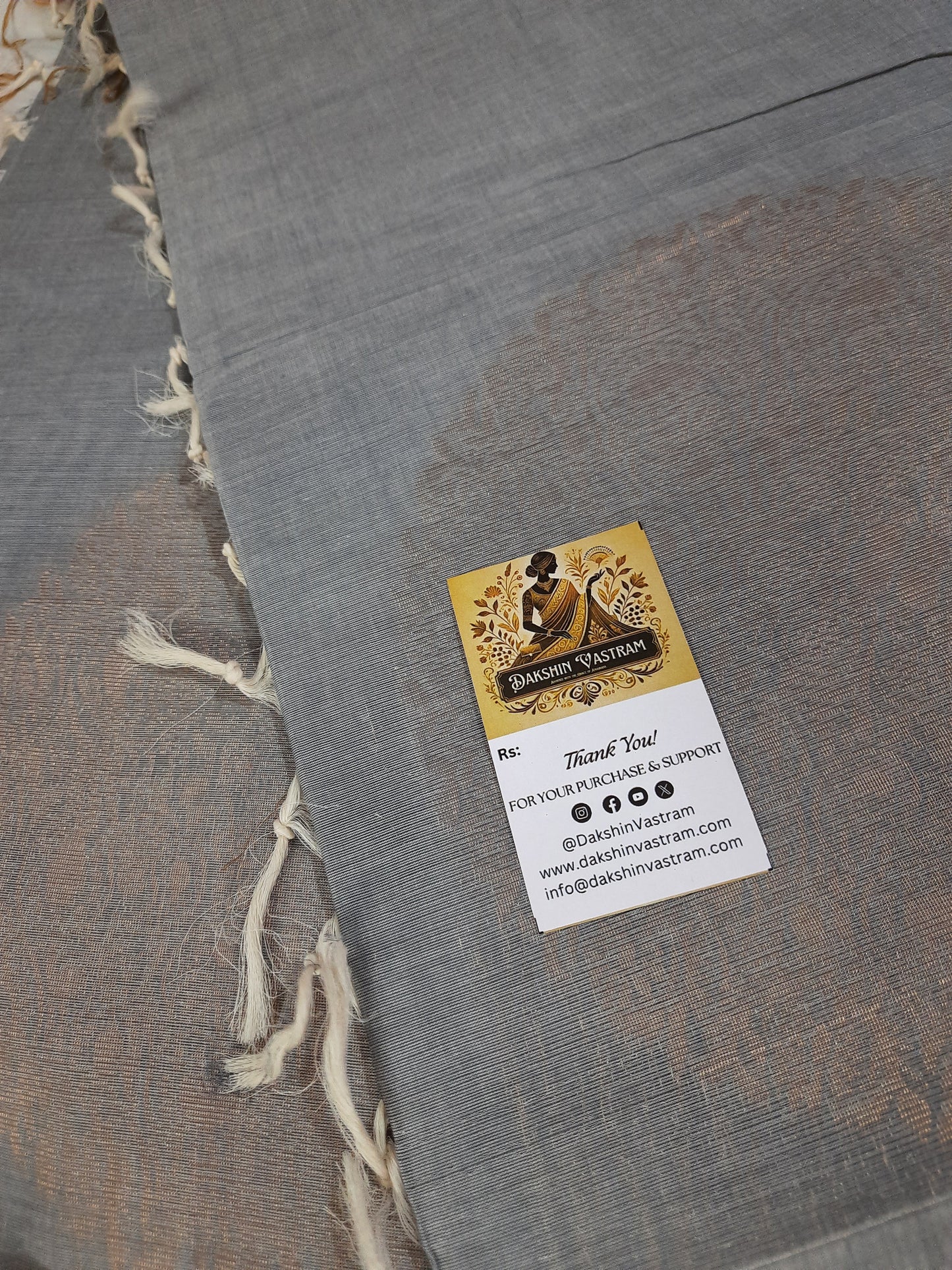 Fabric Rear View: Rear view of handloom fabric with fine copper zari patterns, displaying its rich craftsmanship.