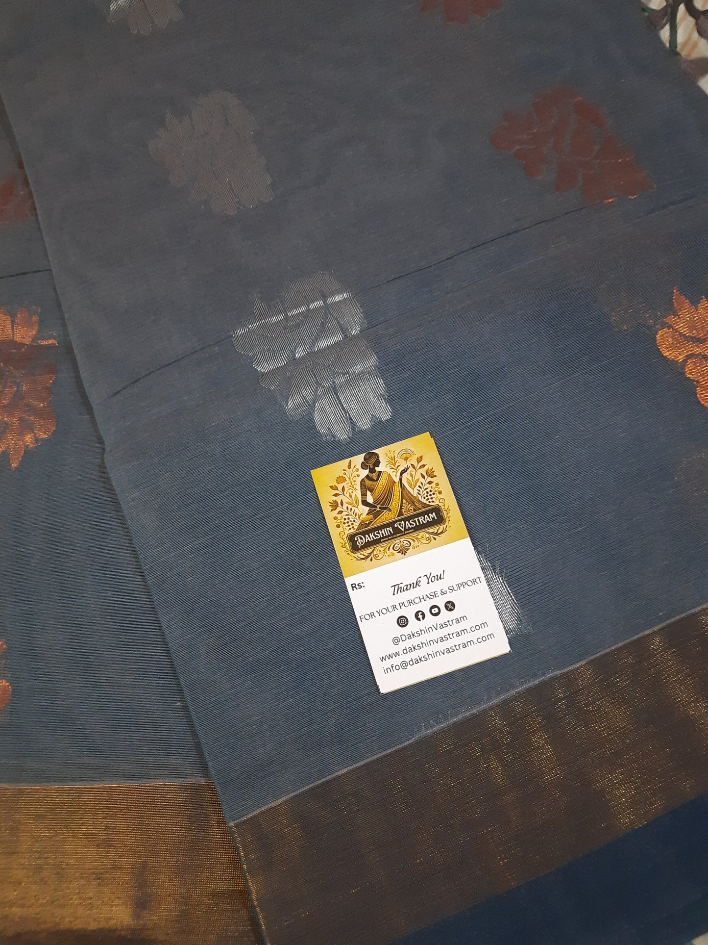 Handloom Copper Zari | Expertly crafted, this Handloom Copper Zari fabric features a luxurious silver color woven with high-quality copper threads