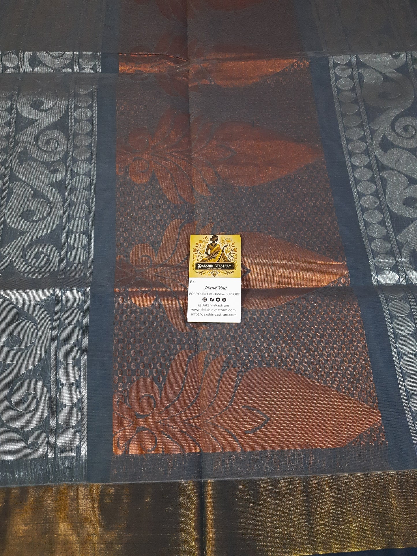 Handloom Copper Zari | Expertly crafted, this Handloom Copper Zari fabric features a luxurious silver color woven with high-quality copper threads
