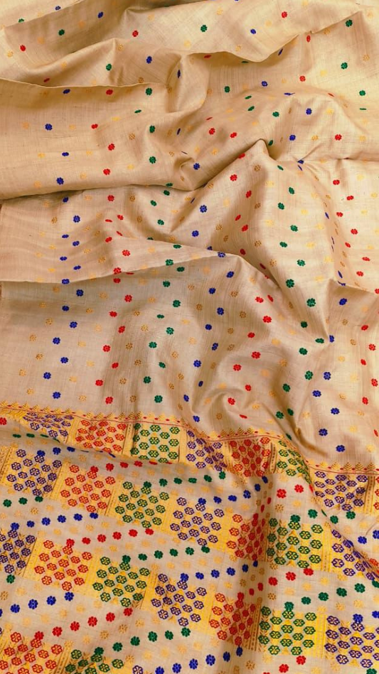 Close-up of pure Muga silk weave with warm golden thread detail – authentic Assam bridal handloom