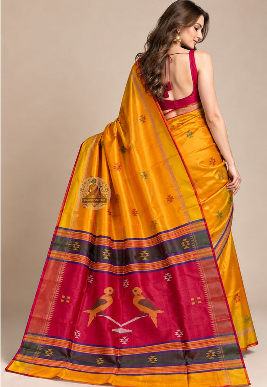 Side view of mustard-yellow Bishnupur silk saree showing the pleated drape and fine red edging