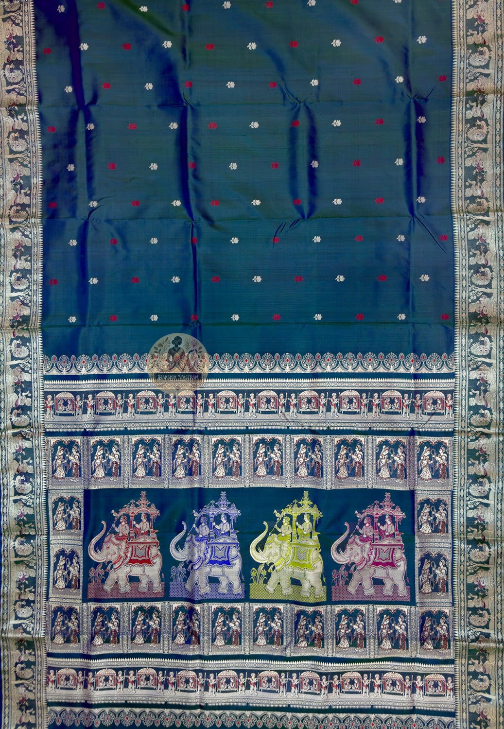 Close-up of Baluchari silk saree pallu showing individually woven Ramayana mythology figures and Malla court compositions in coloured silk thread visible only to those who look closely enough