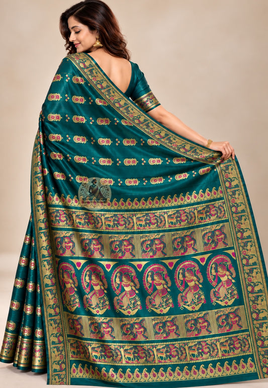 Side view of peacock-green Baluchari silk saree showing flowing folds and a patterned border