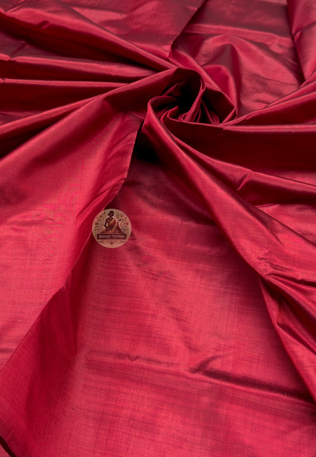 Full saree view of red Bishnupur handloom silk saree with a plain, continuous red design