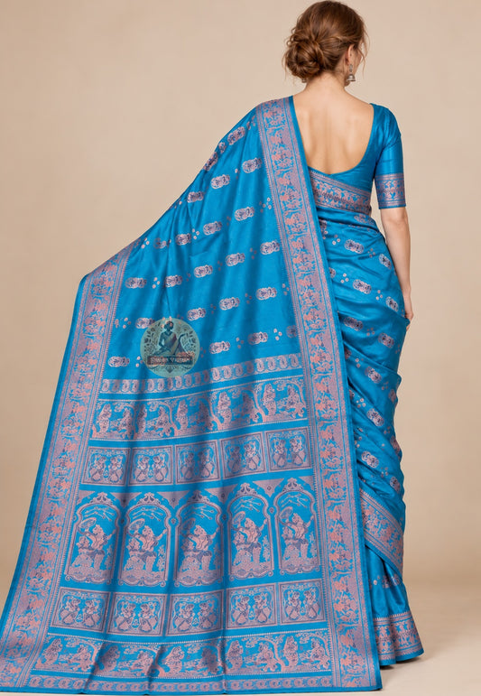 Rear view of teal blue Swarnachari silk saree with the figurative pallu draped over the shoulder