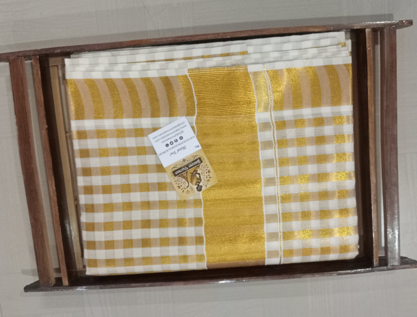 Front side view of Handloom Tissue Checked Saree with intricate checked pattern and fine fabric