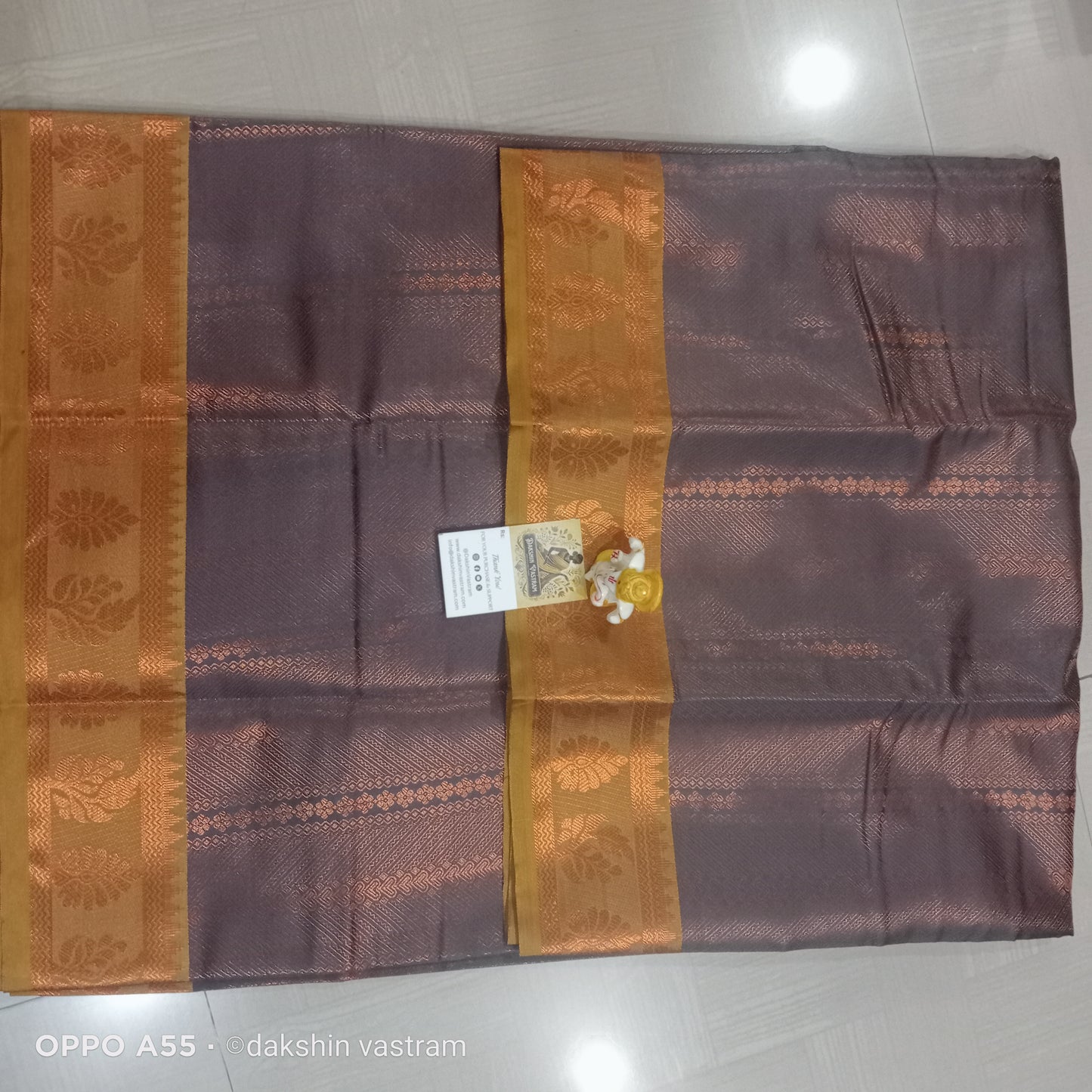 Saree Rear View: Rear view of Mow Silk Saree, emphasizing its luxurious fabric and stunning border details.