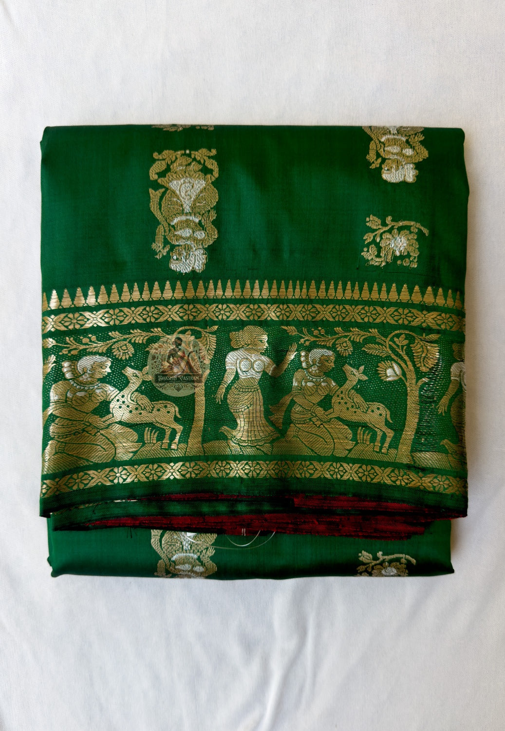 Full flat-lay of Swarnachari pure silk saree with golden zari craft border, Bengal identity narrative pallu, fine buti field, and matching unstitched blouse piece, West Bengal handloom