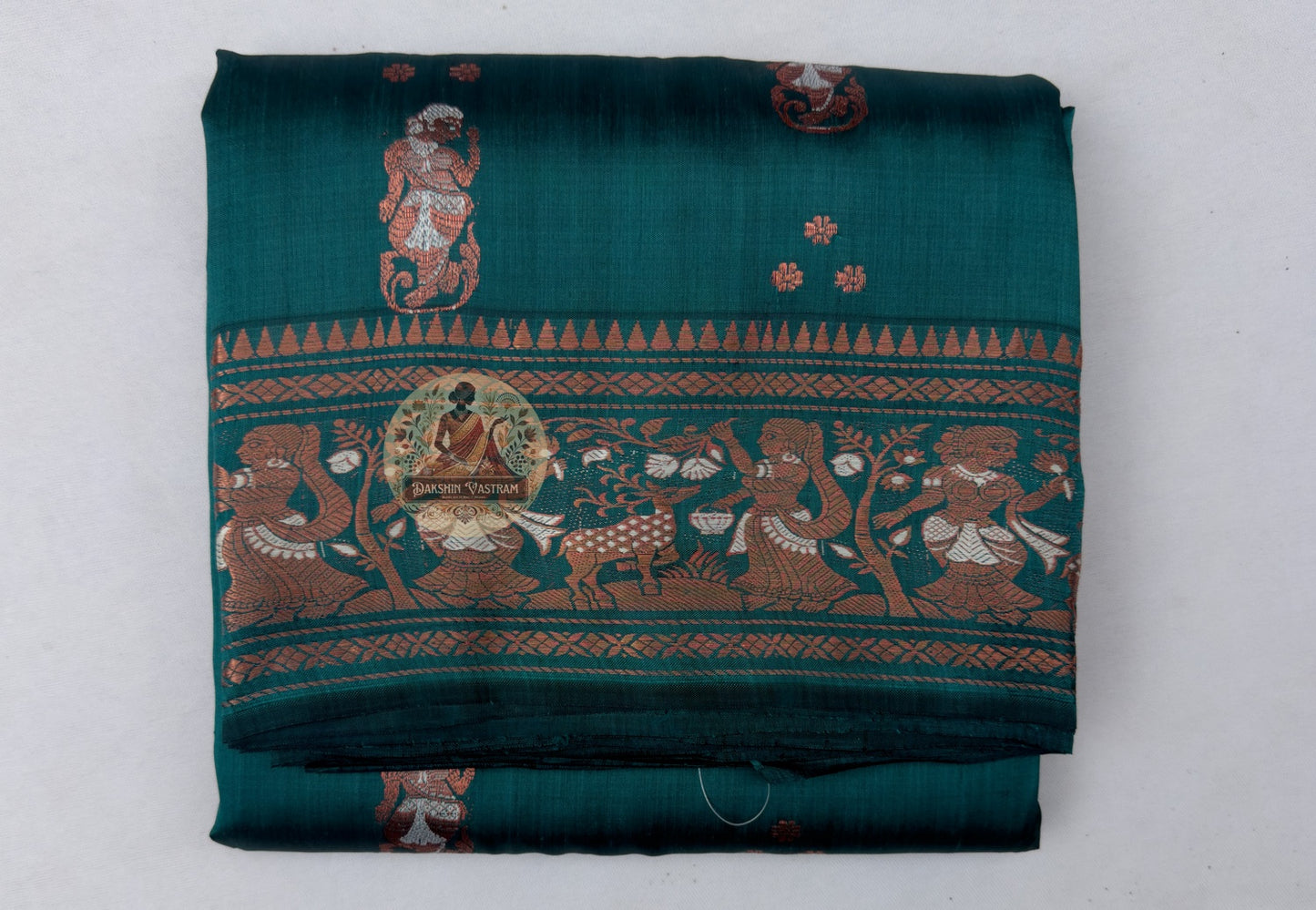 Close-up of bold structured golden zari border on Swarnachari handloom silk saree with fine buti (small woven motif) detailing on silk field
