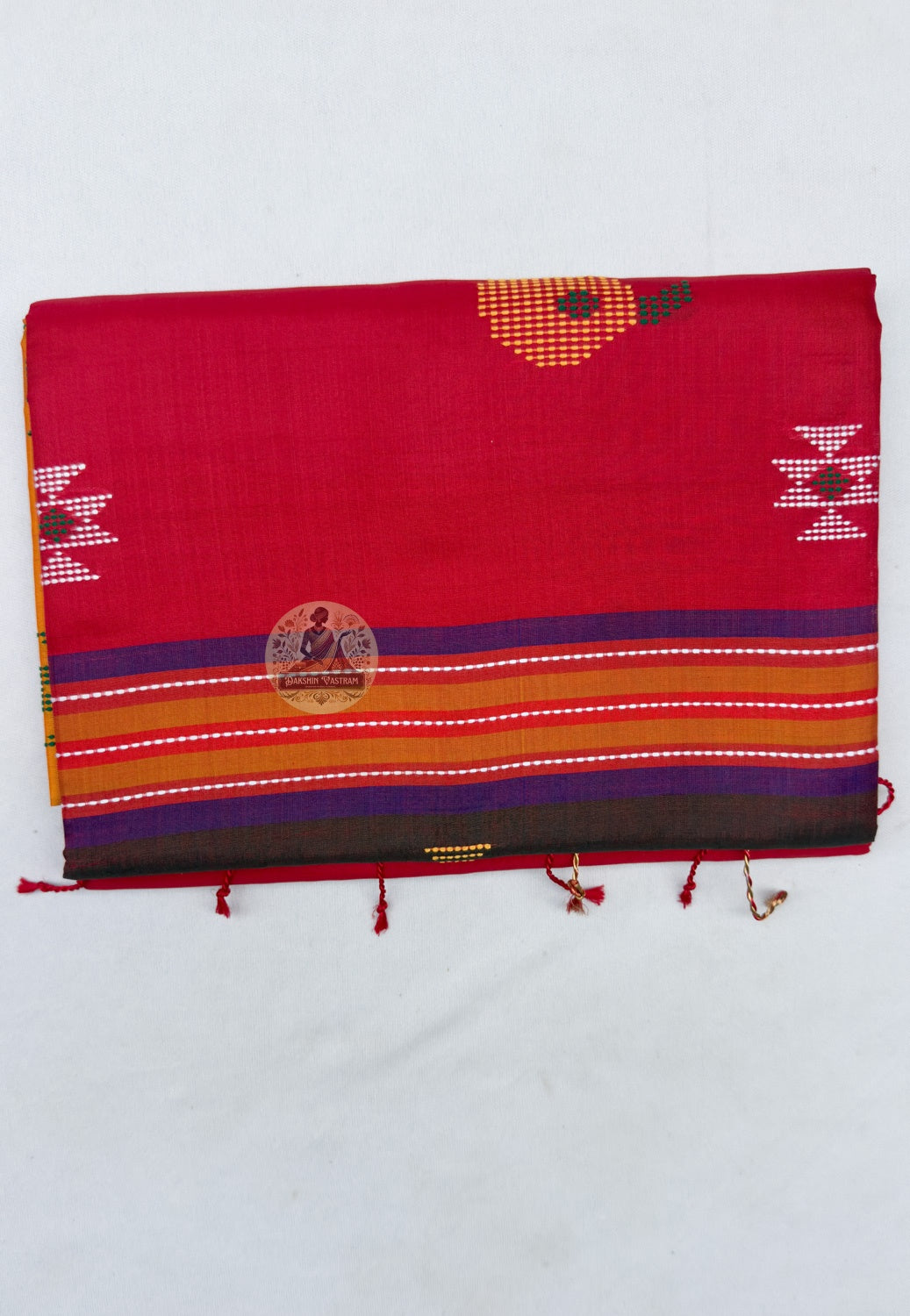 Full saree view highlighting mustard-yellow pleats, red edging and blue-accented bands around the bird pallu