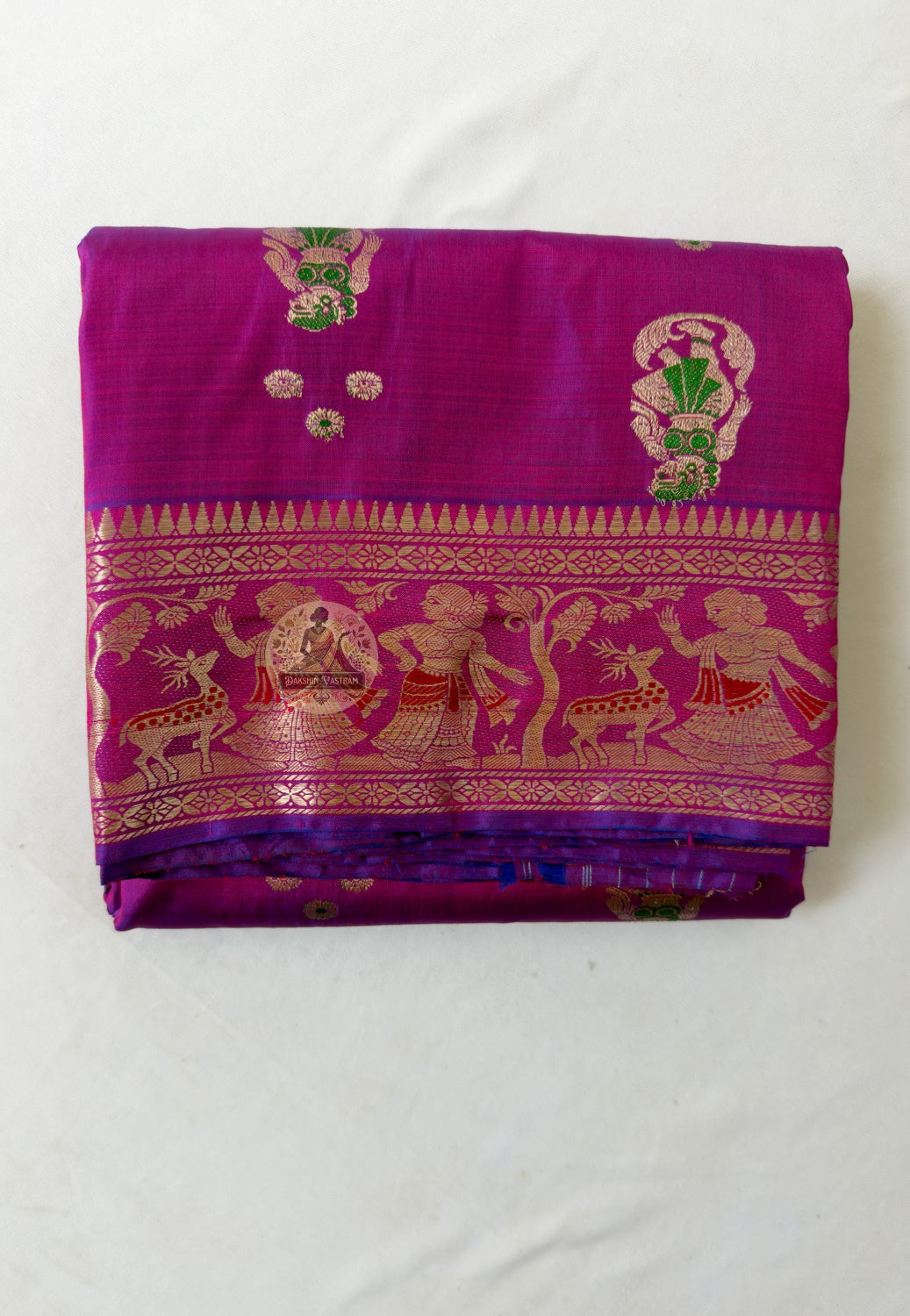 Close-up of purple Swarnachari silk saree weave showing golden zari mythology figures Malla court motifs and Bishnupur temple art patterns brightening against deep purple silk ground
