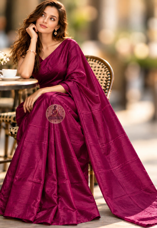 Front view of magenta Bishnupur handloom silk saree with a plain body and lustrous folds