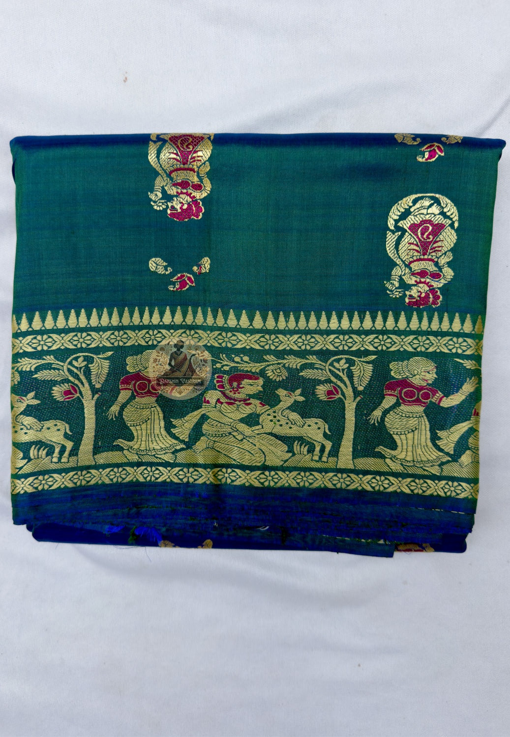 Full saree view of peacock-green Baluchari silk with repeated body motifs and an elaborate narrative pallu