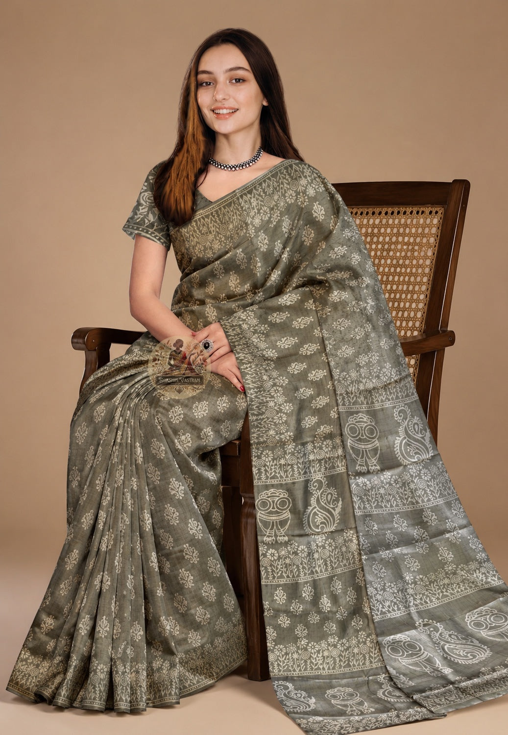 Front view of woman in Bishnupur Katan silk saree, traditional Bengali drape with hand block print pallu carrying Bishnupur's terracotta visual vocabulary over left shoulder