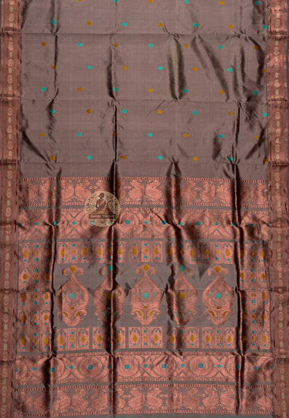 Side view of heirloom Swarnachari handloom silk saree showing finest pure silk drape and precisely laid golden zari border, West Bengal master-weaver craft