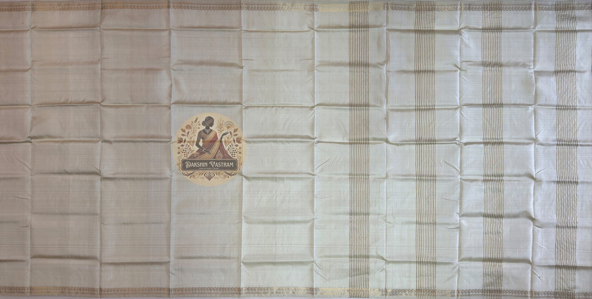 Overhead flat lay of pure silk saree from Bishnupur showing full 6-yard length, pallu detail and woven border