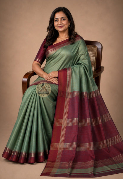 Front view of woman wearing Bishnupur Katan Silk Saree with gold temple jewellery, festive occasion