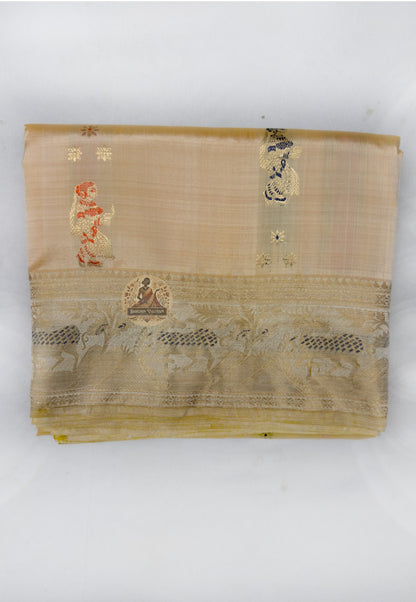 Close up of small coral and dark-toned motifs on the champagne gold saree body