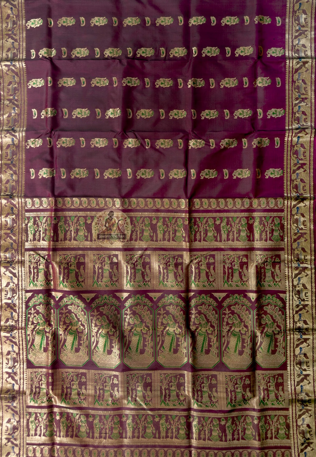 Close-up of Swarnachari silk saree weave showing individually woven golden zari mythology figures Malla court compositions and Bishnupur temple art patterns on pure silk ground