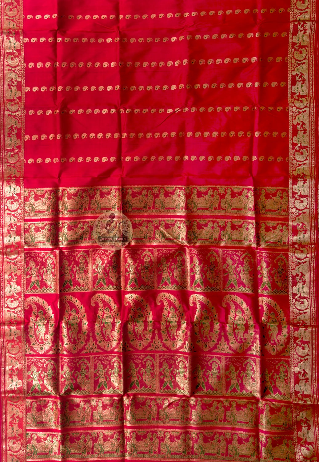 Rear view of Swarnachari silk saree displaying golden zari pallu with hand-woven Bengal temple and Ramayana story compositions held in suspension, West Bengal handloom
