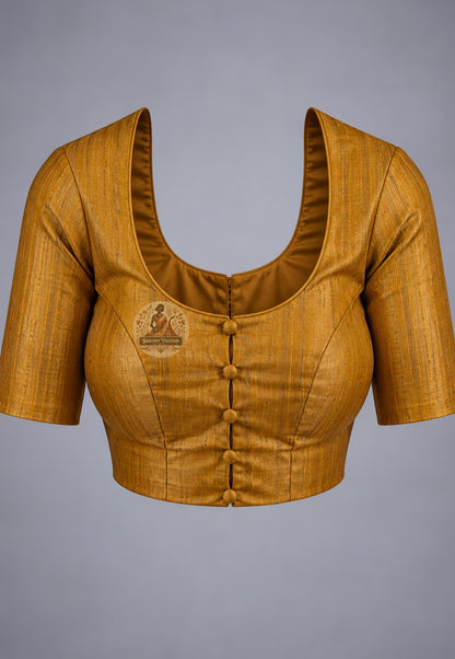 Blouse paired with mustard Ghicha Tussar silk saree in a coordinating mustard shade with patterned sleeve borders