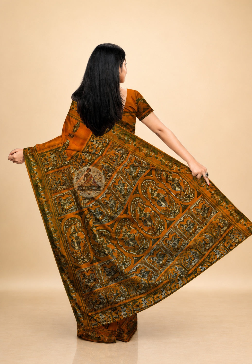 Back drape of handwoven Baluchari silk saree displaying the ornate pallu with hand-woven mythological scenes from Bengal's Bishnupur loom tradition