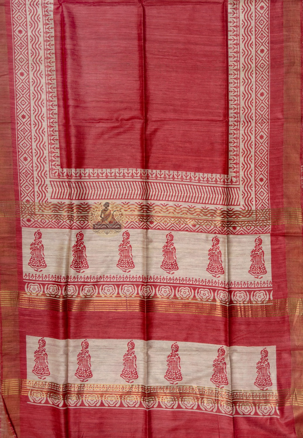 Close up of red Ghicha Tussar silk saree border with diamond and zigzag patterns