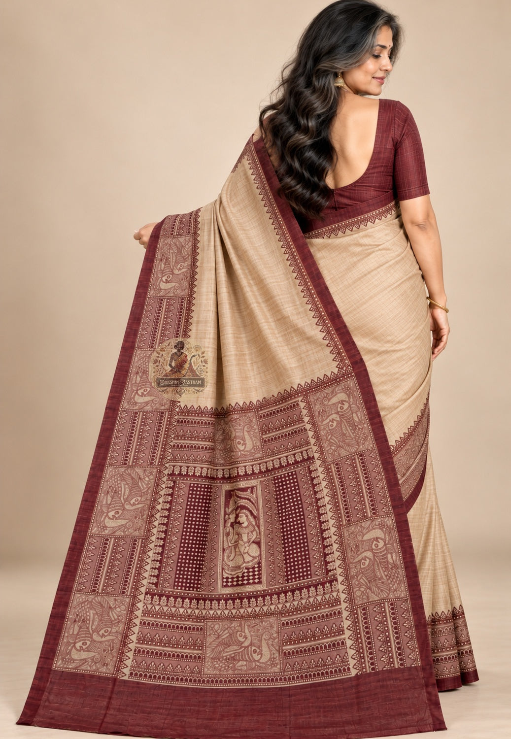 Rear view of beige Ghicha Tussar silk saree with the decorative pallu draped over the shoulder