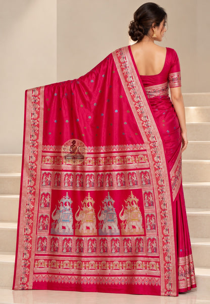 Rear view of cherry-red Baluchari silk saree with the elephant narrative pallu draped over the shoulder