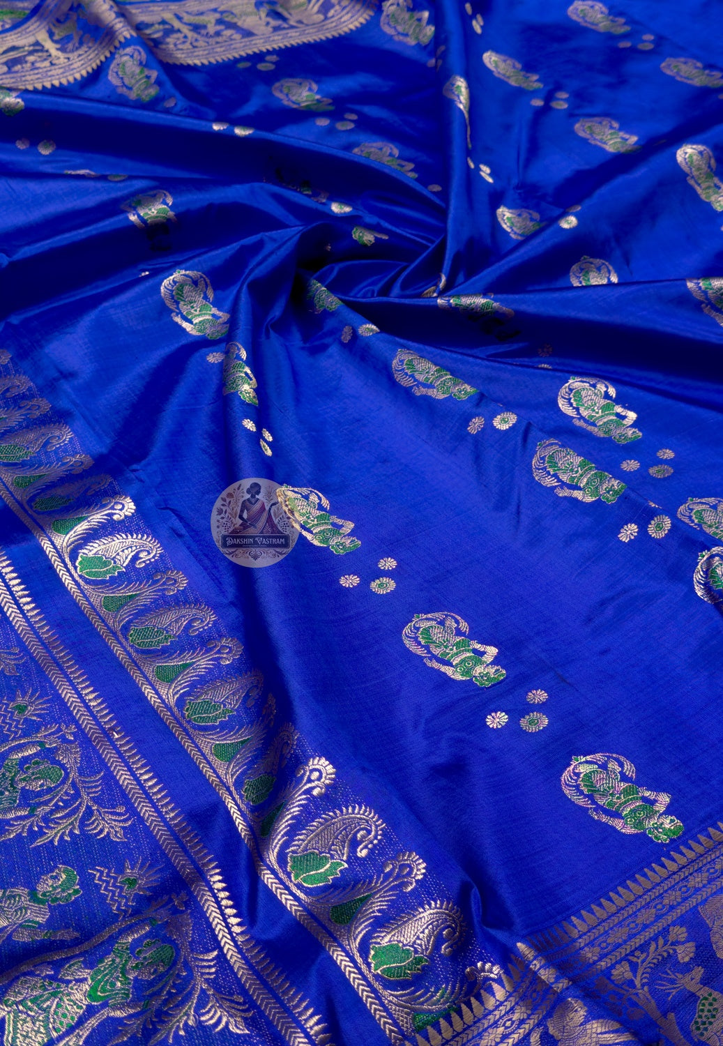 Close-up of golden zari temple arch border detail on Swarnachari Silk Saree Diwali bridal Bengal handloom