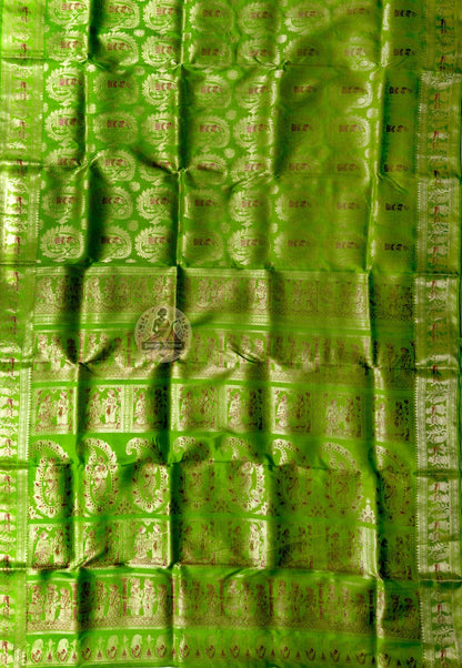 Side view of Swarnachari Pure Katan Silk Saree showing Dashami sindoor khela drape and golden zari red hibiscus handloom border Bishnupur