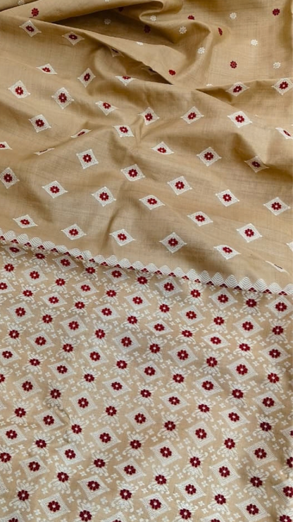 Front view of Assam handloom Muga silk saree with a golden-beige base and red floral motifs.