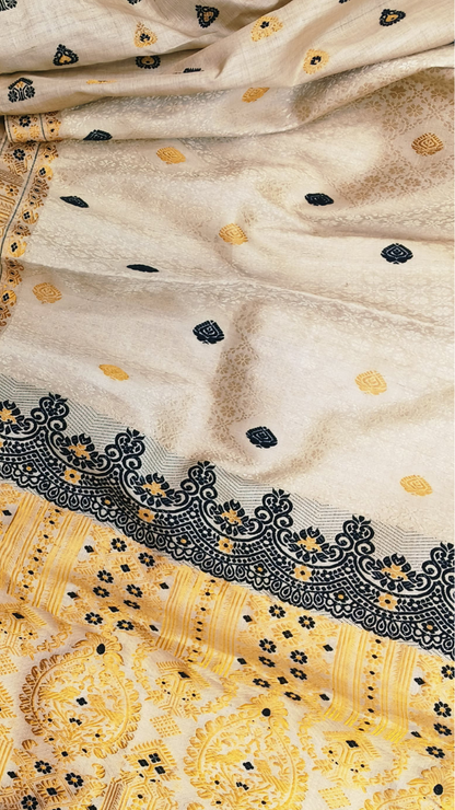 Muga silk saree in natural champagne-gold drape, handwoven in Assam — Dakshin Vastram heritage collection
