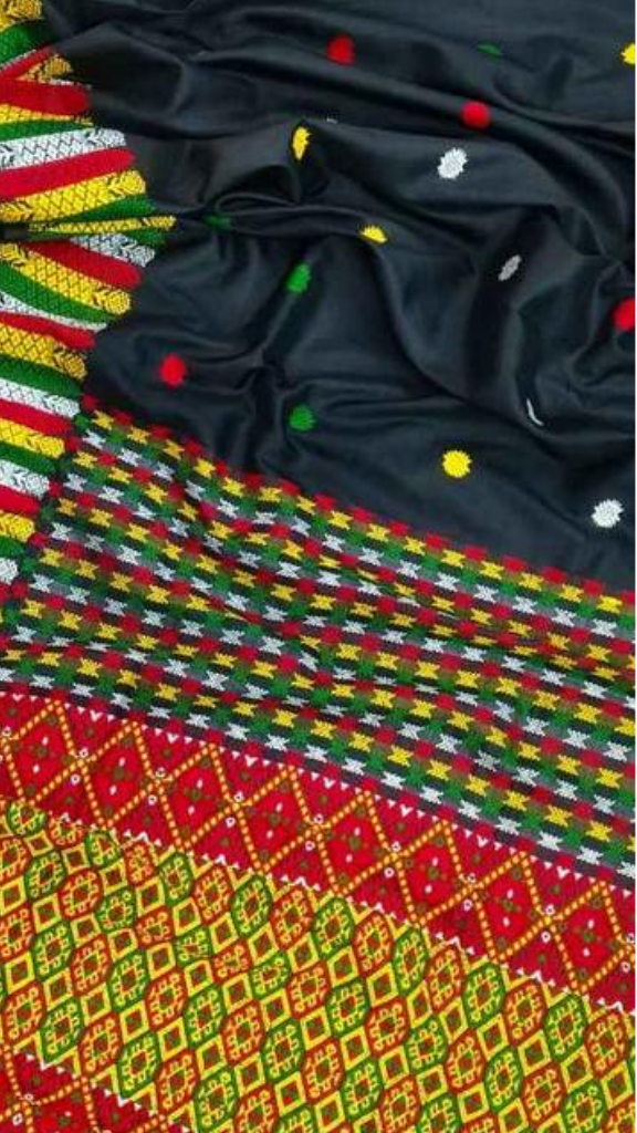 Front view of Assam Mulberry Silk Saree with colour motifs draped on model, showcasing vibrant handwoven folk art patterns against luminous pure silk