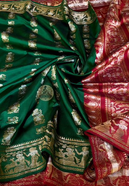 Rear view of Swarnachari silk saree displaying golden zari pallu with hand-woven Bengal temple carving and Mughal miniature-inspired craft identity panels
