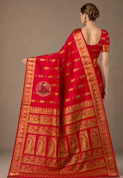 Front view of woman in Swarnachari pure silk saree, traditional Bengali drape with golden zari pallu carrying Bengal's recovered visual traditions over left shoulder