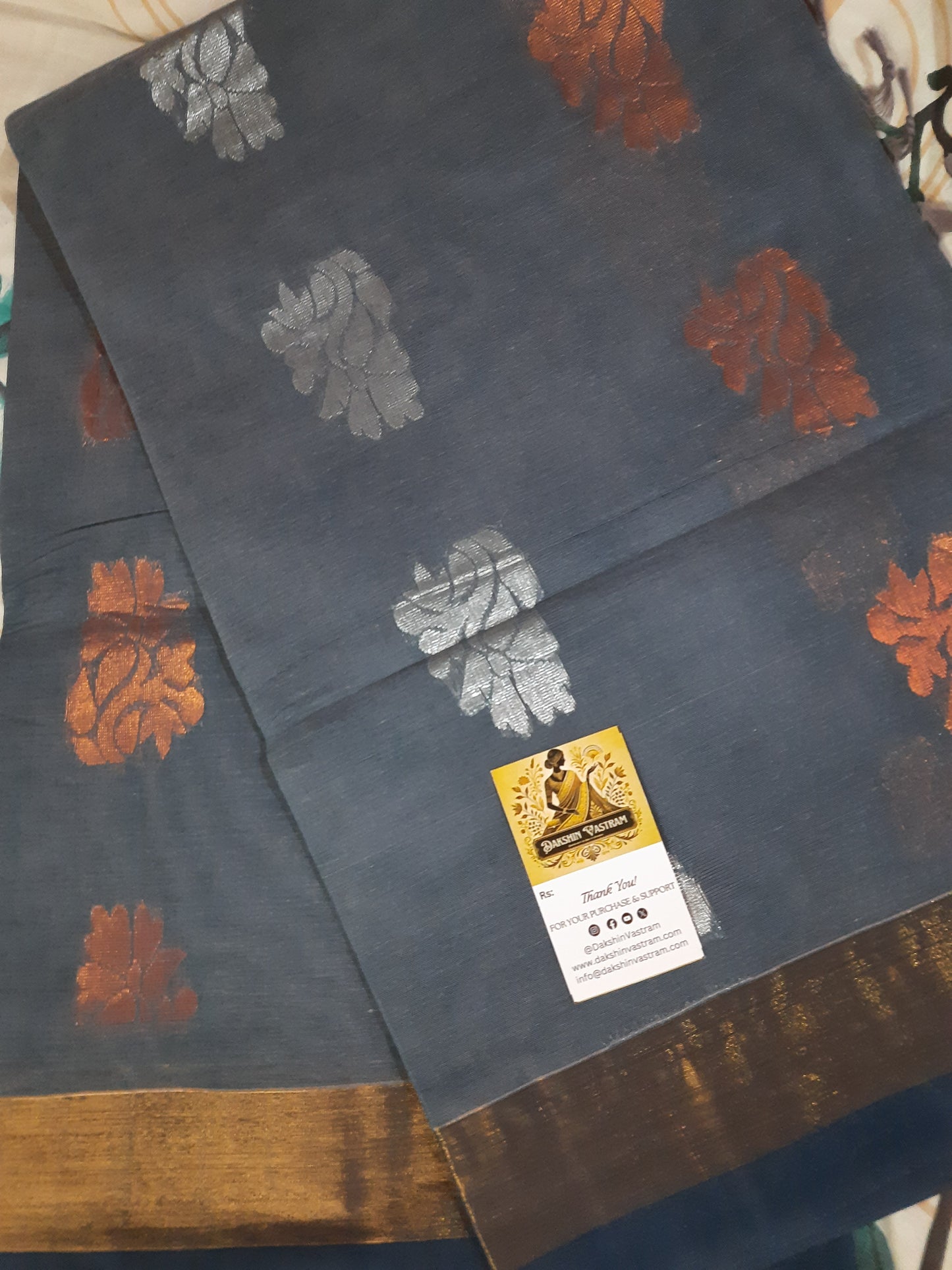 Handloom Copper Zari |  Expertly crafted, this Handloom Copper Zari fabric features a luxurious silver color woven with high-quality copper threads