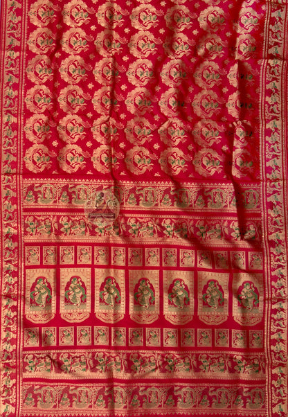 Close-up of Swarnachari silk saree pallu featuring hand-woven golden zari mythological motifs and temple art