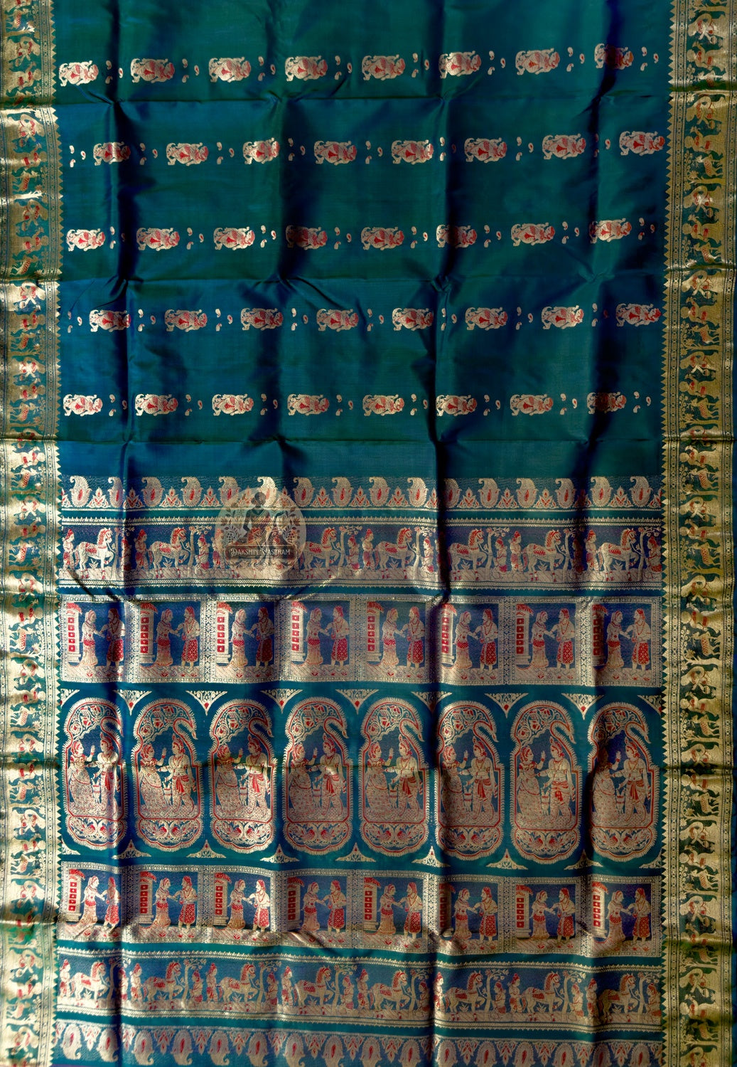 Close-up of Swarnachari silk saree weave showing pure golden zari thread woven directly into silk forming mythological motifs in Bengali handloom tradition