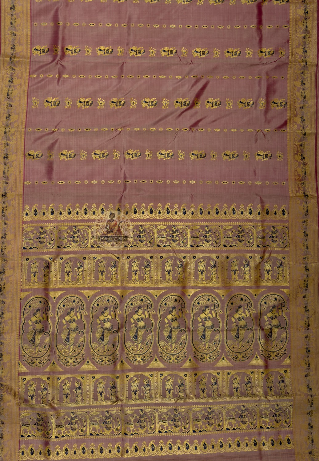Side view of handloom Baluchari pure silk saree from Bishnupur showing narrative border panels and naturally lustrous pure silk drape, pictorial scenes built into the fabric not printed