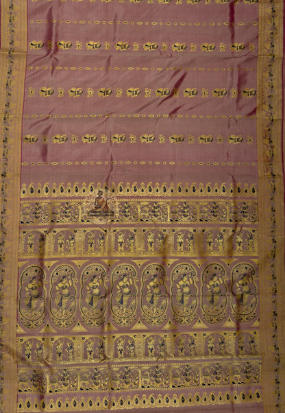 Side view of handloom Baluchari pure silk saree from Bishnupur showing narrative border panels and naturally lustrous pure silk drape, pictorial scenes built into the fabric not printed