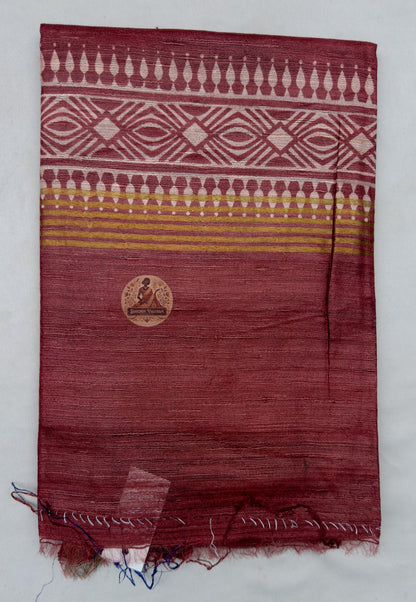 Full saree view highlighting deep red pleats, contrasting borders and the striped decorative pallu