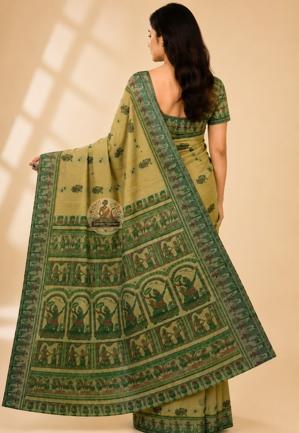 Rear view of Beige Baluchari Silk Saree revealing the full pallu with hand-woven Mahabharata and Ramayana motifs glowing against the warm beige pure Bengal silk ground