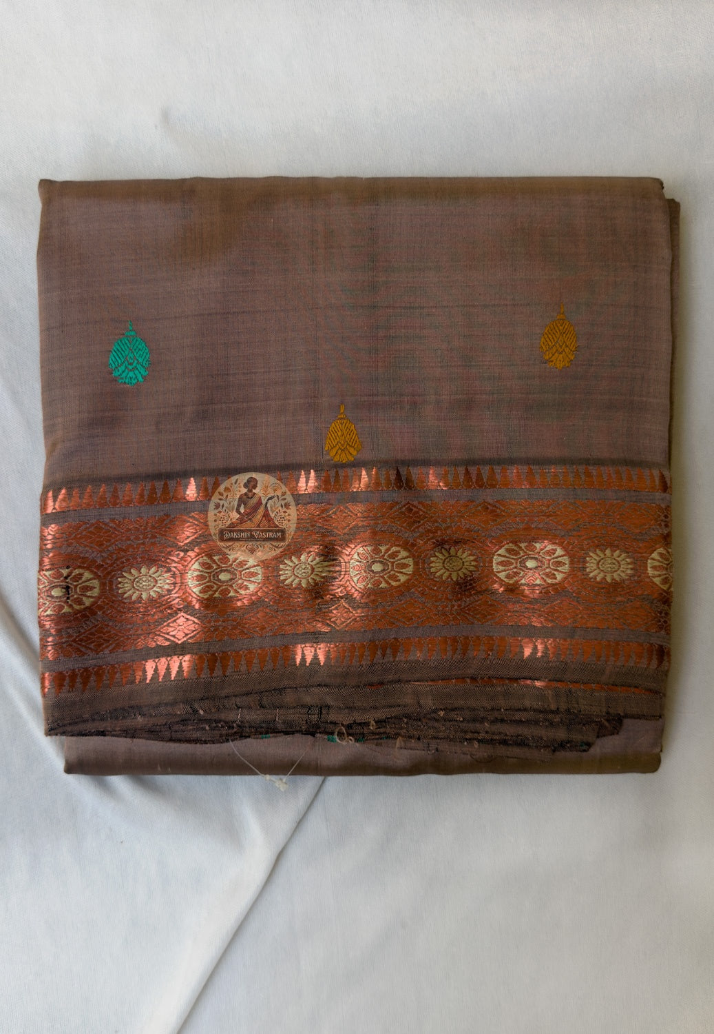 Full flat-lay of heirloom Swarnachari pure silk saree with master-woven golden zari border, unified narrative pallu, fine buti field, and matching unstitched blouse piece, West Bengal handloom