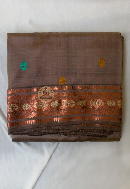 Full flat-lay of heirloom Swarnachari pure silk saree with master-woven golden zari border, unified narrative pallu, fine buti field, and matching unstitched blouse piece, West Bengal handloom