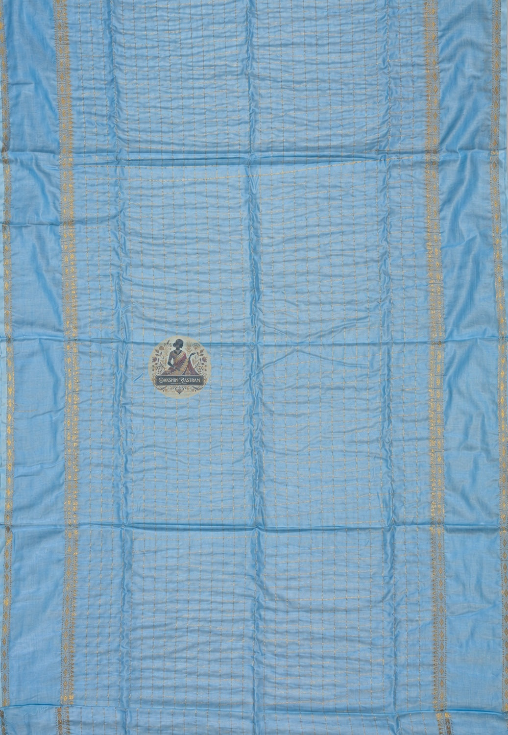 Close-up of handloom cotton zari weave showing fine cotton texture, gold zari thread work, and traditional craftsmanship