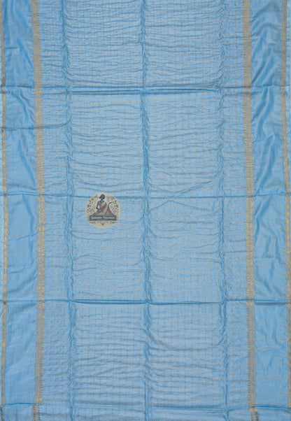 Close-up of handloom cotton zari weave showing fine cotton texture, gold zari thread work, and traditional craftsmanship