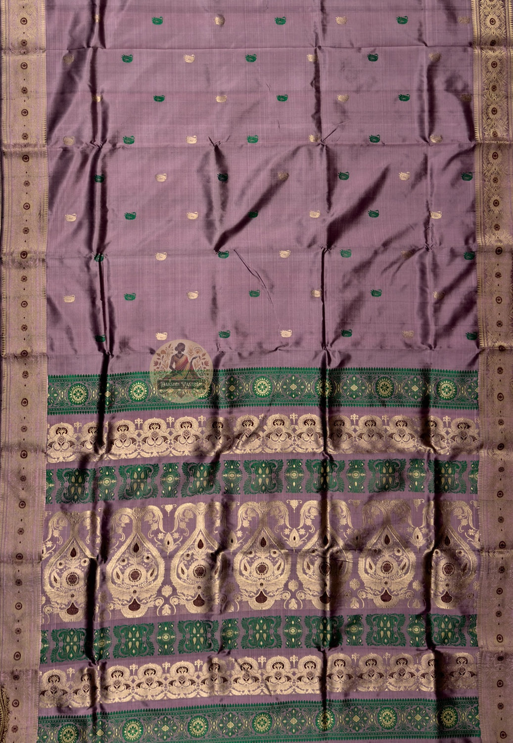Rear view of Swarnachari silk saree displaying golden zari pallu with hand-woven Bengal temple and Ramayana declaration compositions stated with the assurance of centuries of practice