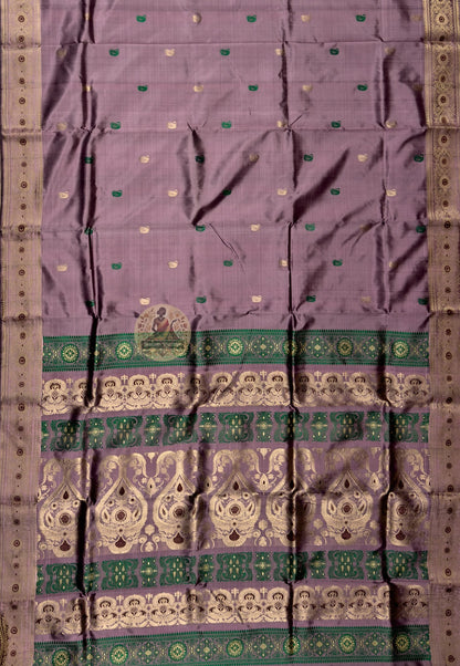 Rear view of Swarnachari silk saree displaying golden zari pallu with hand-woven Bengal temple and Ramayana declaration compositions stated with the assurance of centuries of practice