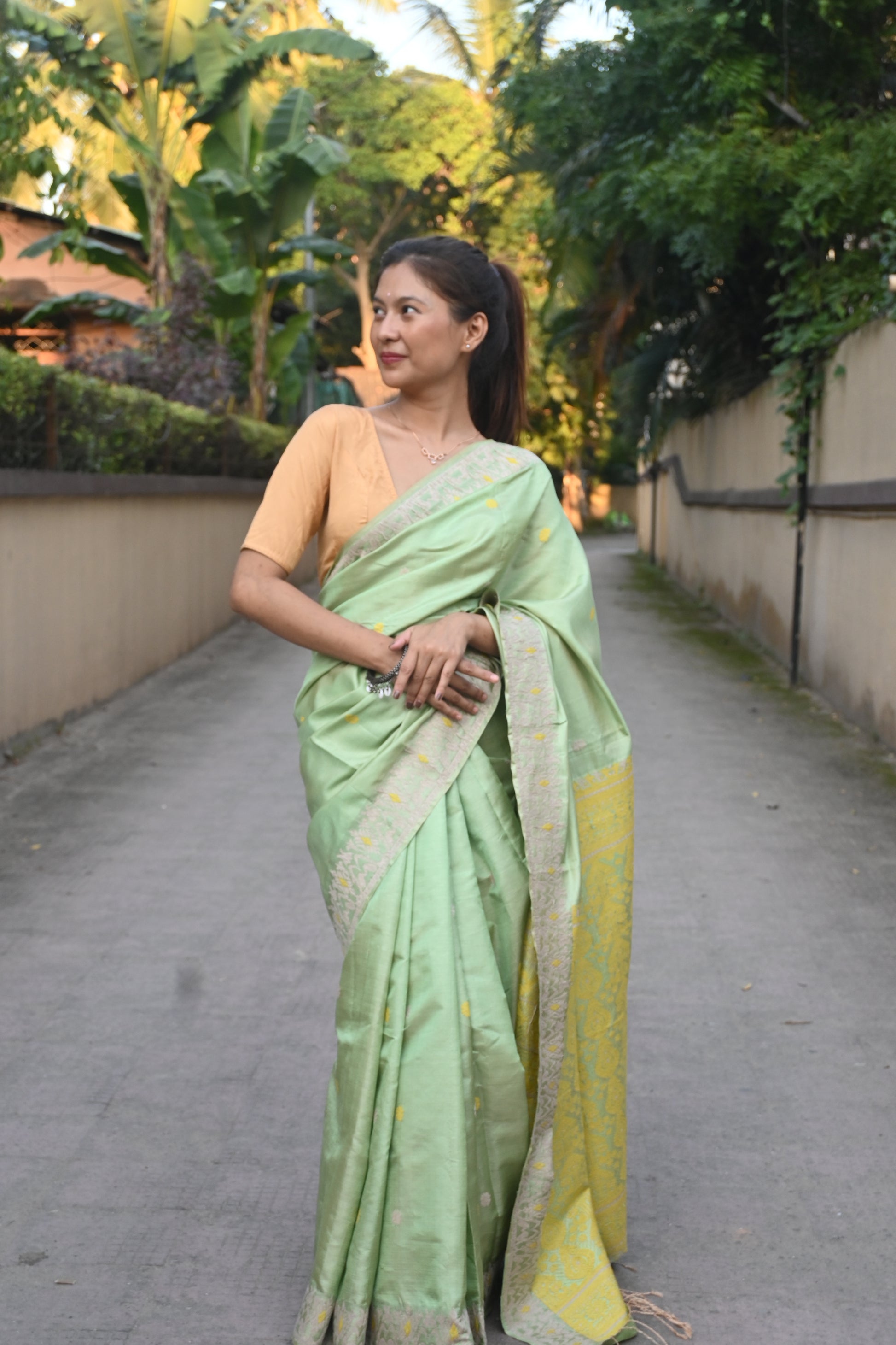 Shop Assam Handloom Silk Saree – Side drape showcasing border weave